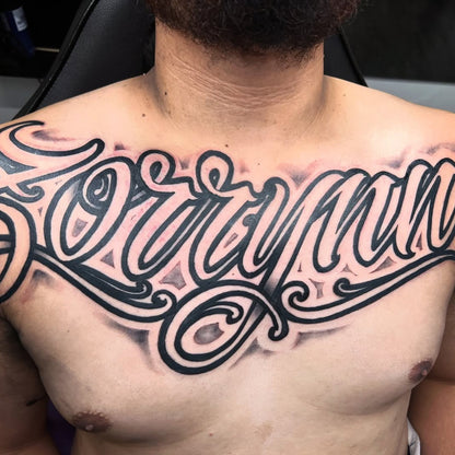 AhChong Ink script chest tattoo - Pacifik Elements